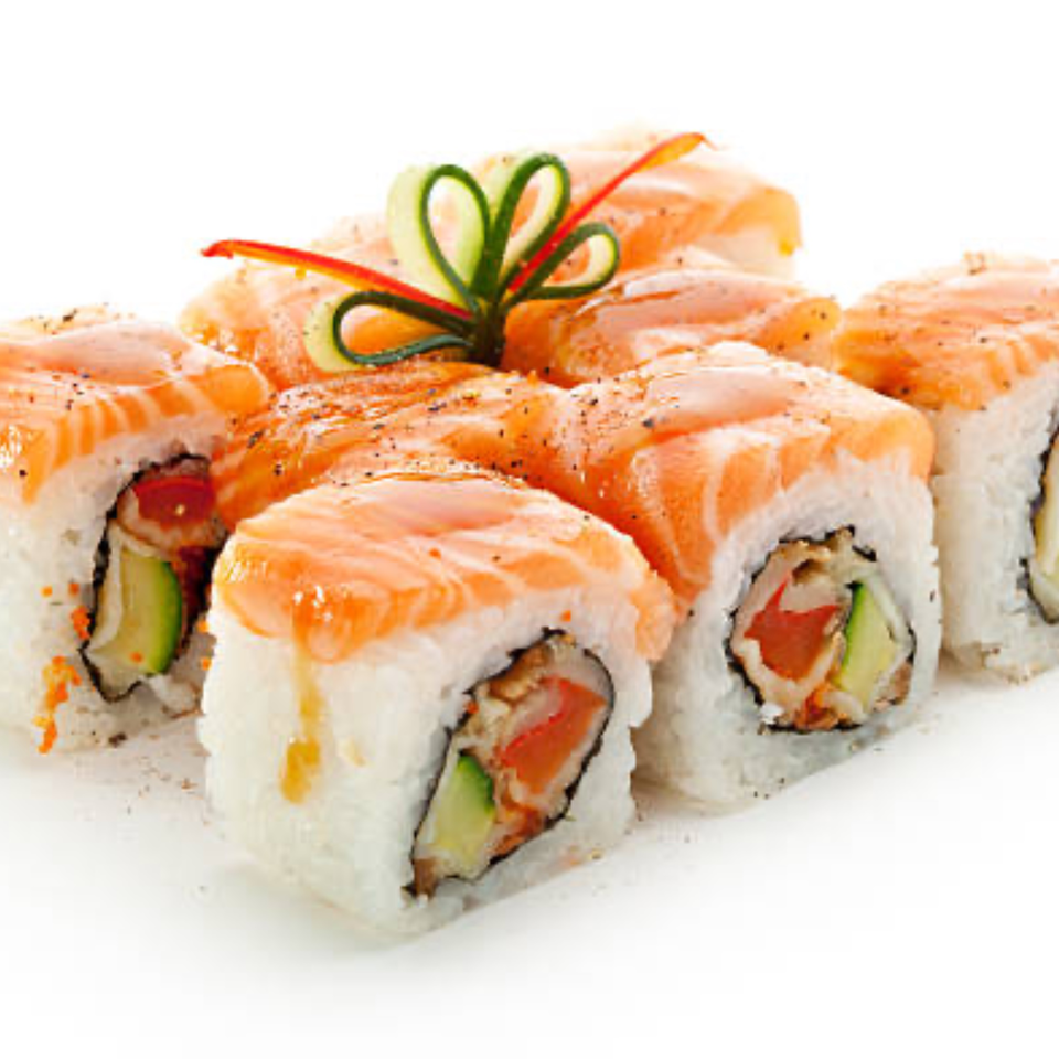 Tropical Sushi's salmon rolls, garnished with cucumber hearts and red pepper strips.